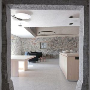 OFIS Arhitekti renovates stone house in Slovenia to feel “ancient and alive”