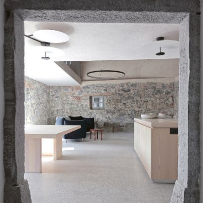 OFIS Arhitekti renovates stone house in Slovenia to feel “ancient and alive”