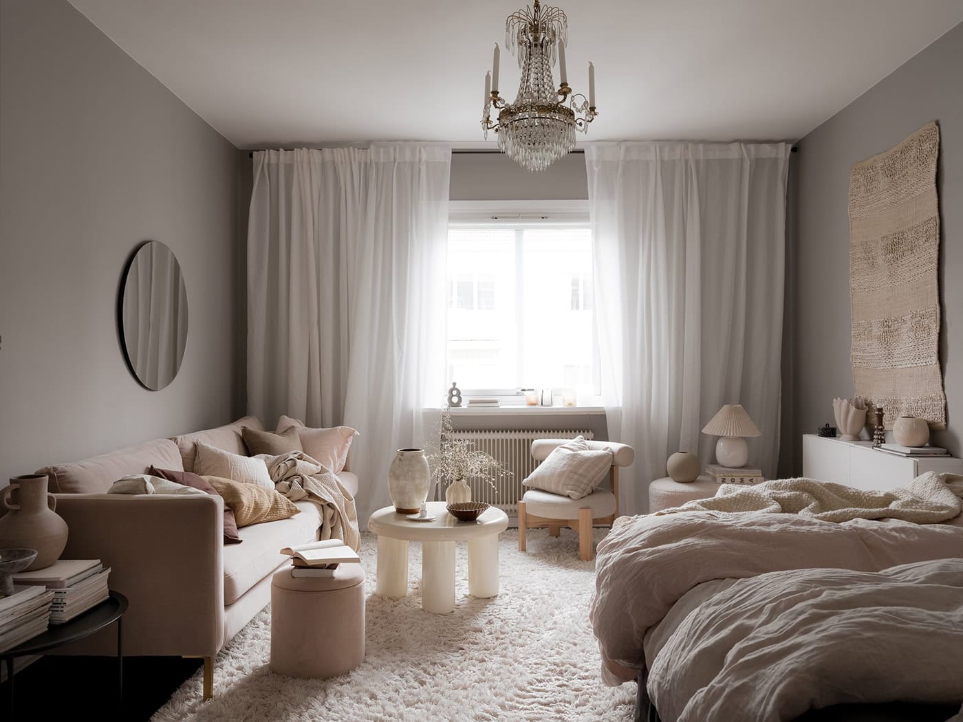 A studio flat with grey walls and a soft decor palette