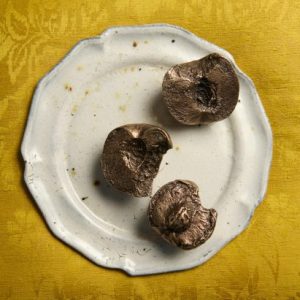 Luca Guadagnino evokes Call Me by Your Name with sensuous peach paperweights for JW Anderson